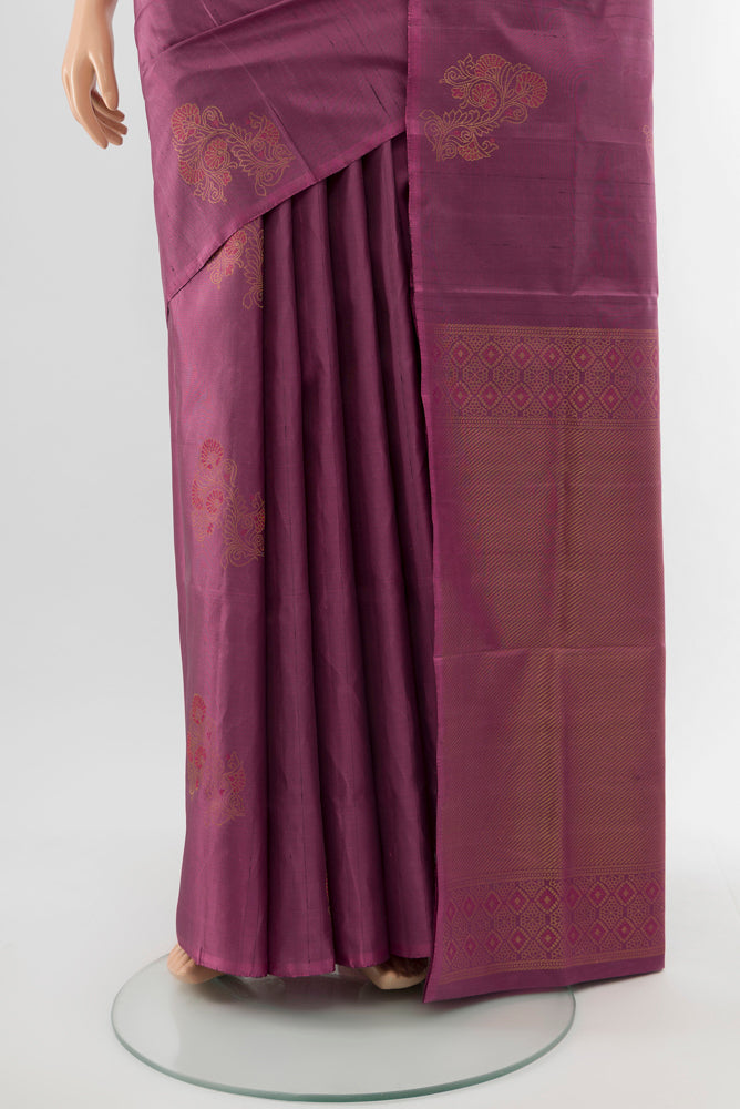 Pleats and pallu of Bronze Soft Silk Saree with Zari Butta on the body and Silk Border. 