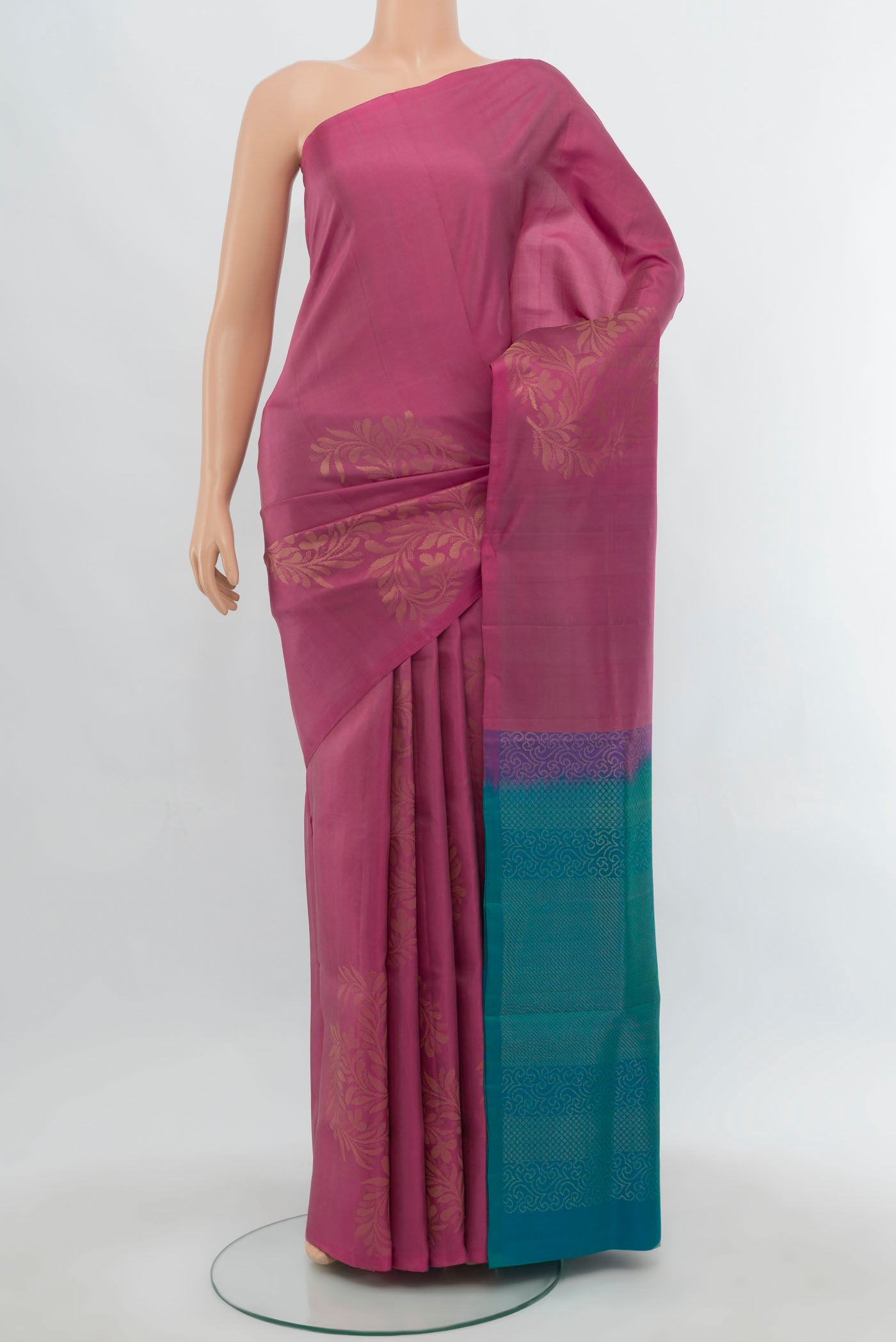 Imperial Pink Soft Silk Saree with Zari Butta on the body and Silk Border.  displayed on a mannequin