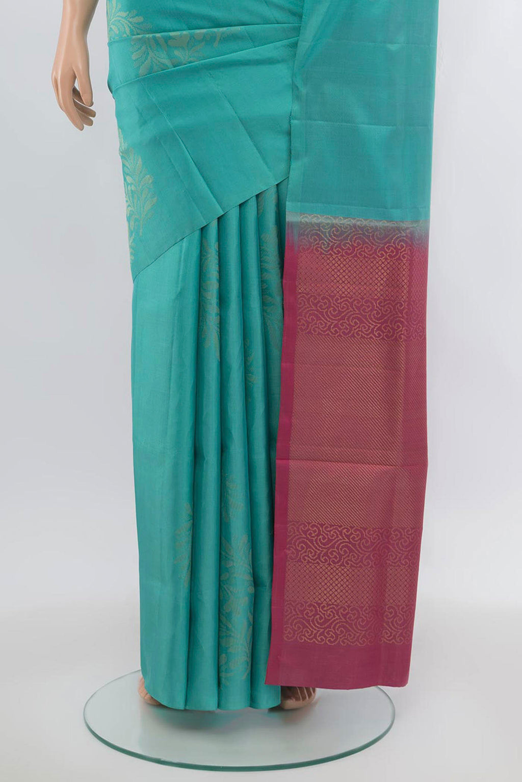 Pleats and pallu of Sea Green Soft Silk Saree with Zari Butta on the body and Zari Border. 