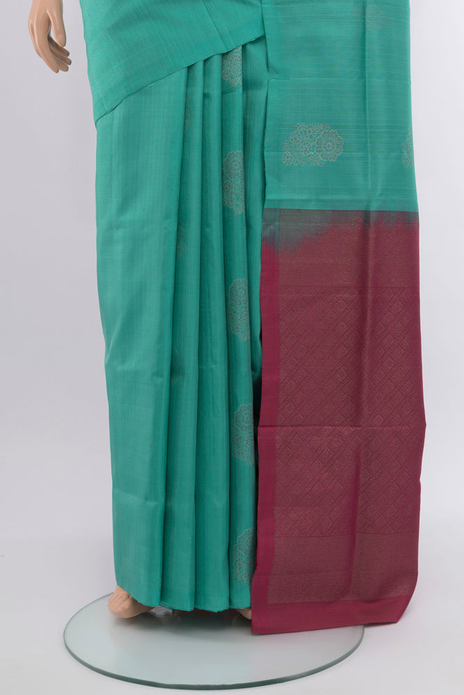 Pleats and pallu of Sky Blue Soft Silk Saree with Zari Butta on the body and Silk Border. 