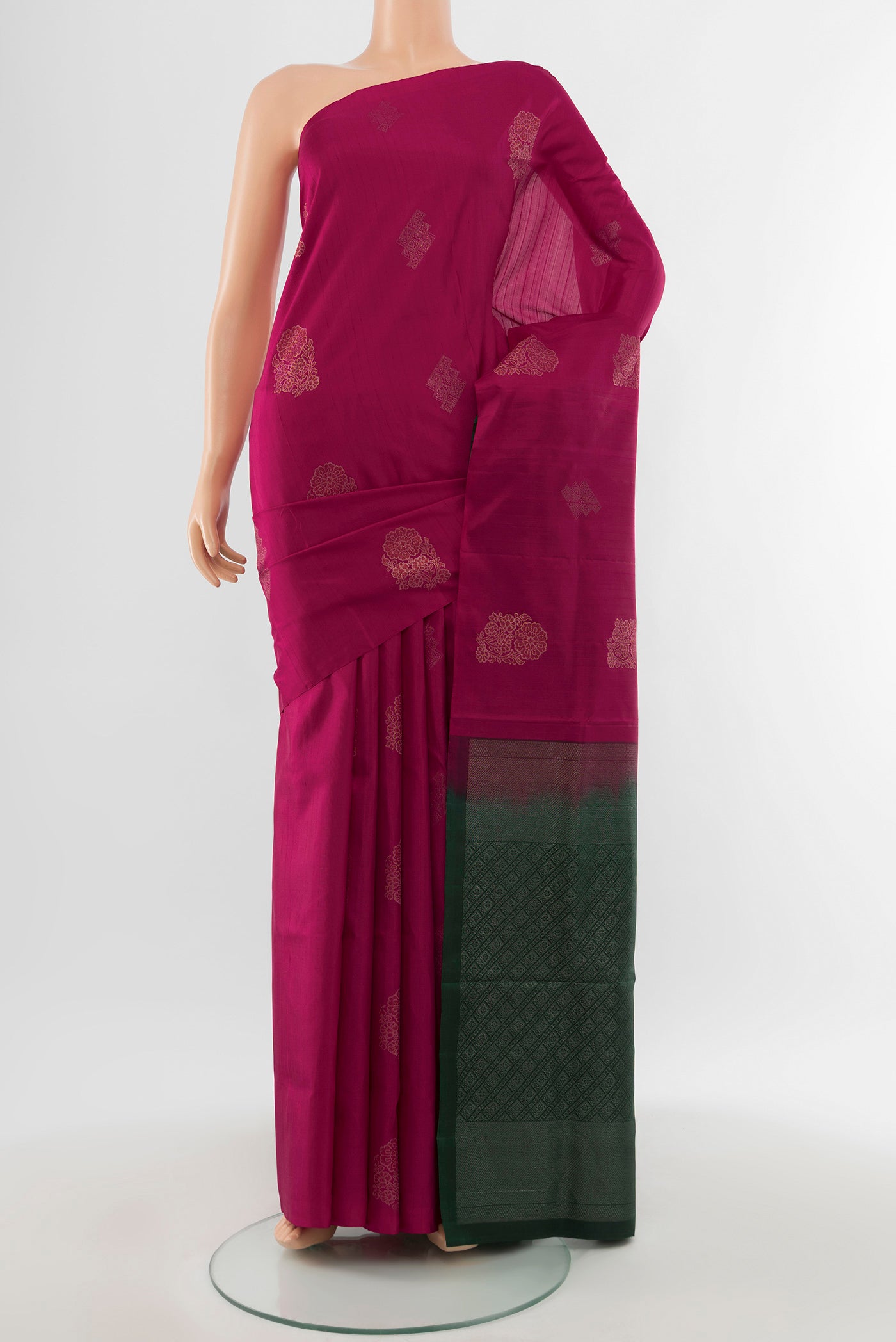 Pure Silk Pure Zari Maroon Soft Saree with Zari Butta on the body and Silk Border.  displayed on a mannequin