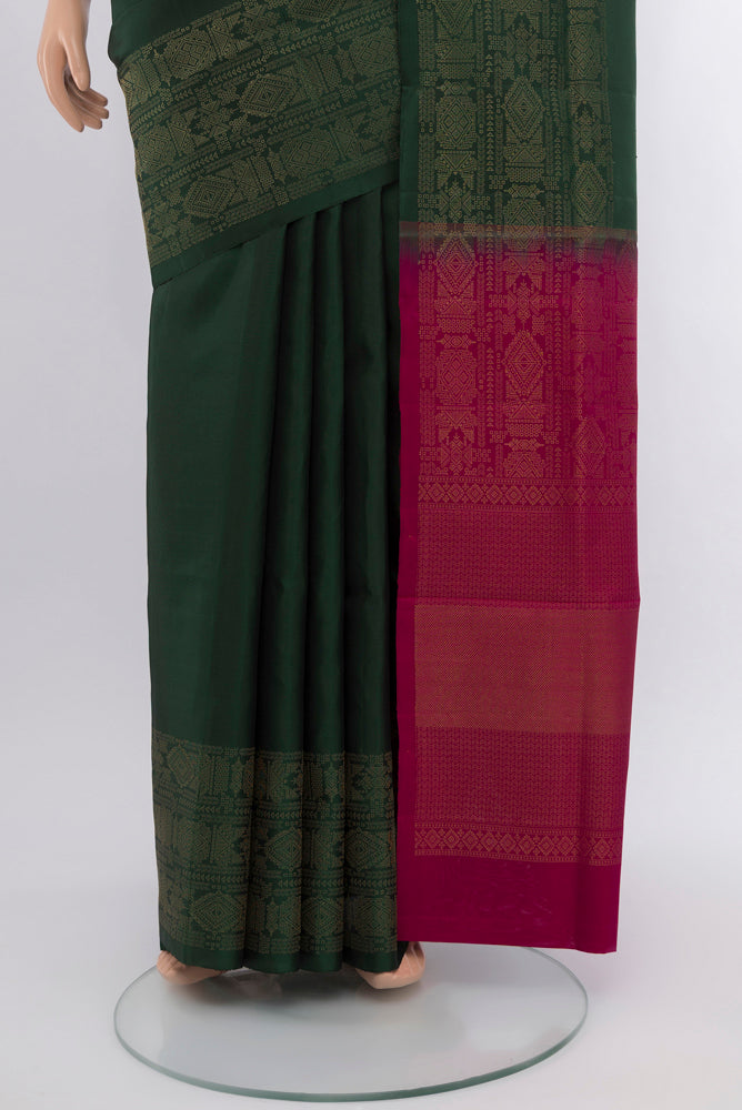 Pleats and pallu of Mint Green Soft Silk Saree with Zari Butta on the body and Silk Border. 