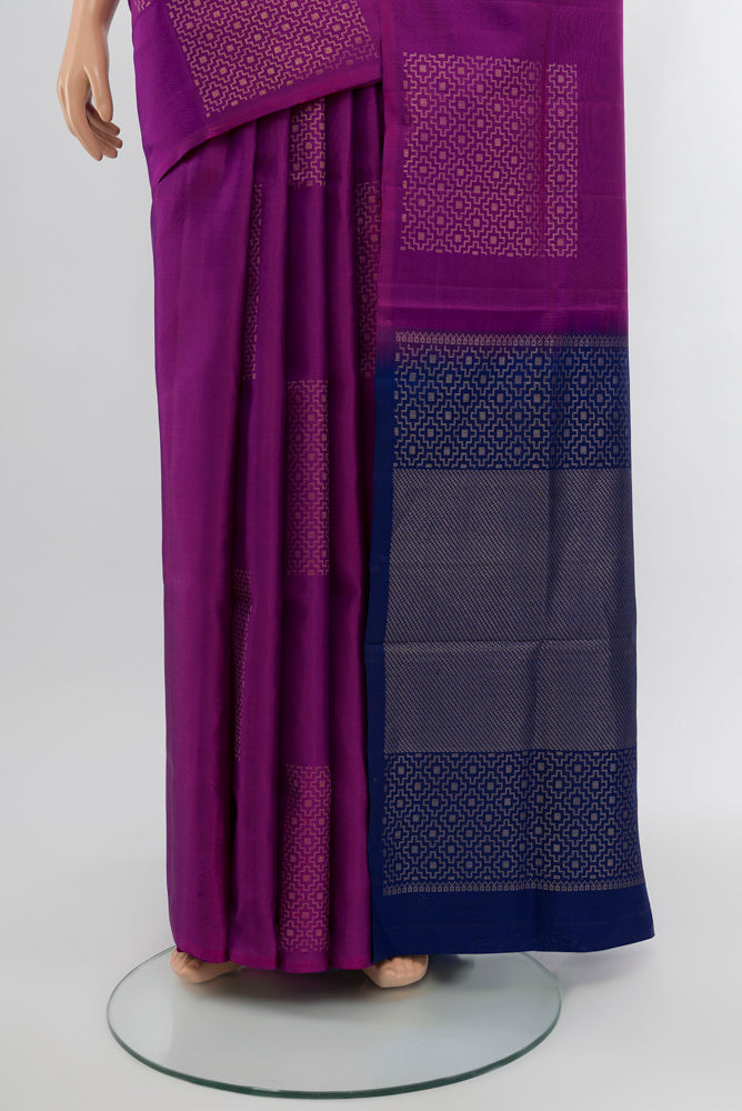 Pleats and pallu of Purple Soft Silk Saree with Zari Butta on the body and Silk Border. 