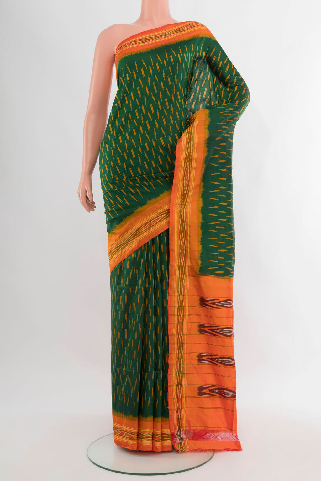 Bottle Green Pochampally Silk Saree with Ikat design on the body and Ikat Border.  displayed on a mannequin