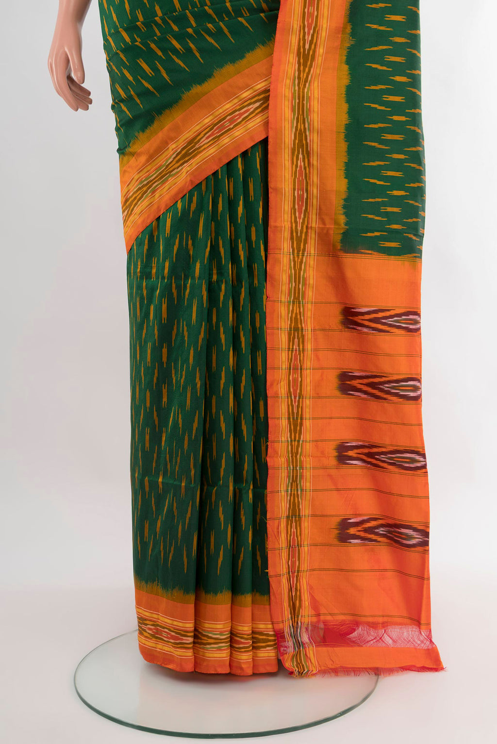 Pleats and pallu of Bottle Green Pochampally Silk Saree with Ikat design on the body and Ikat Border. 