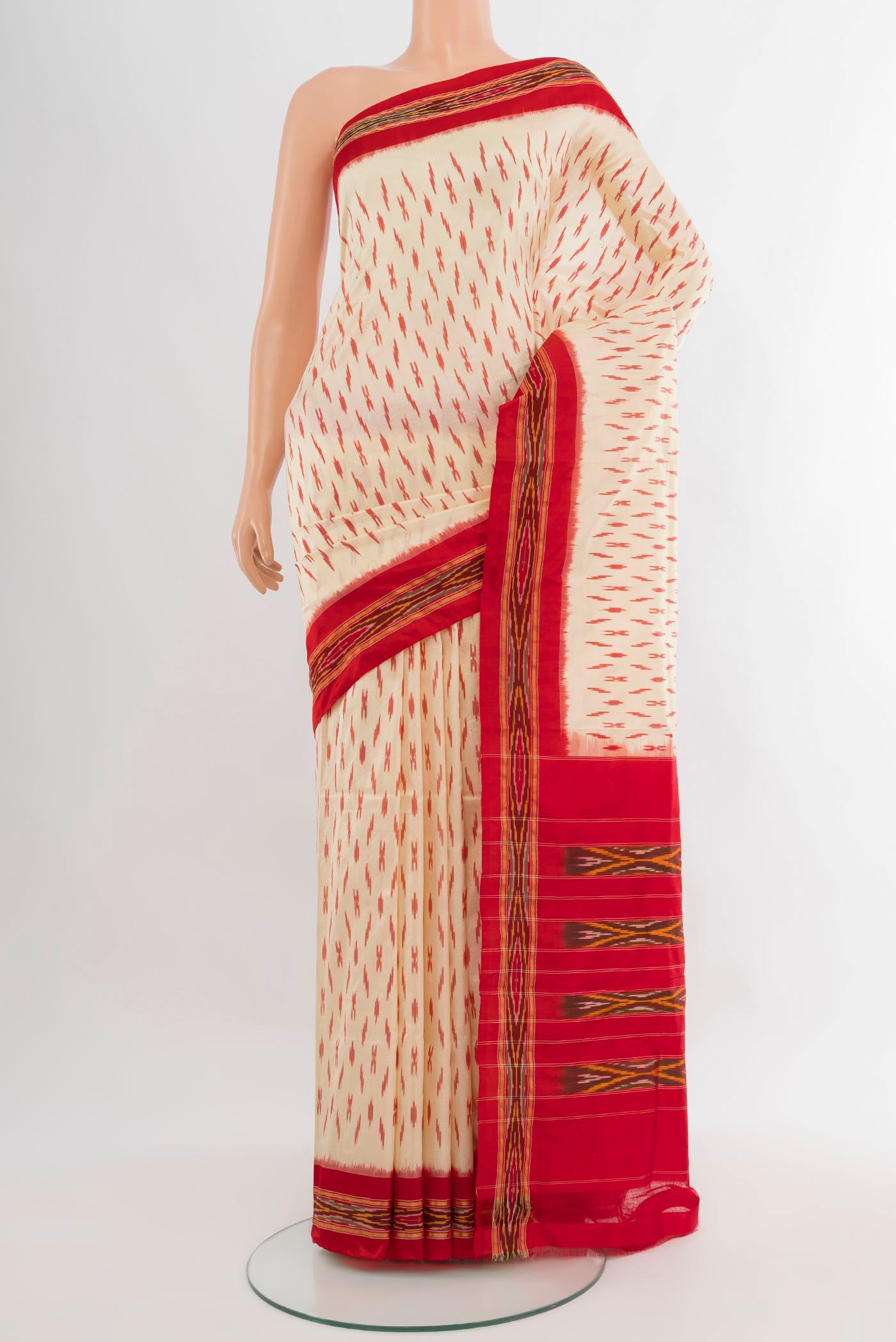 Cream Pochampally Silk Saree with Ikat design on the body and Ikat Border.  displayed on a mannequin