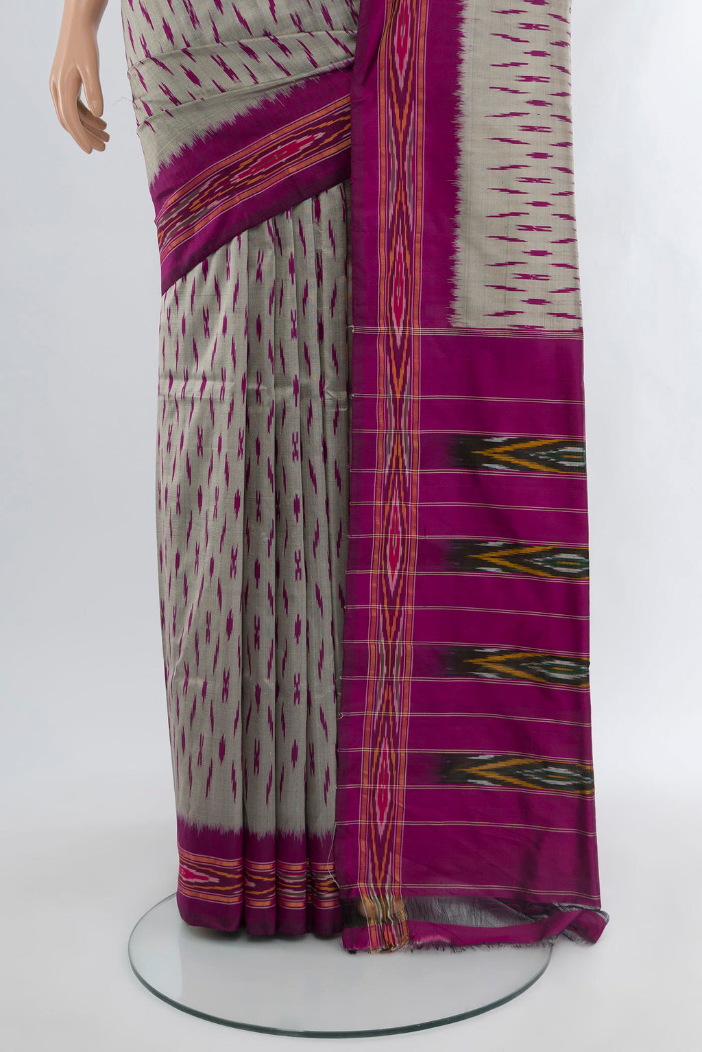 Pleats and pallu of Grey Pochampally Silk Saree with Ikat design on the body and Ikat Border. 