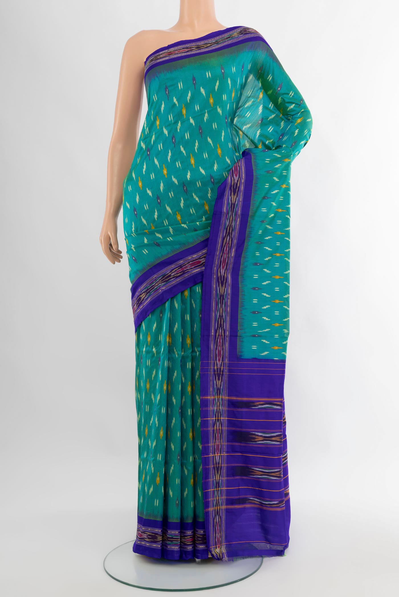 Sea Green Pochampally Silk Saree with Ikat design on the body and Ikat Border.  displayed on a mannequin