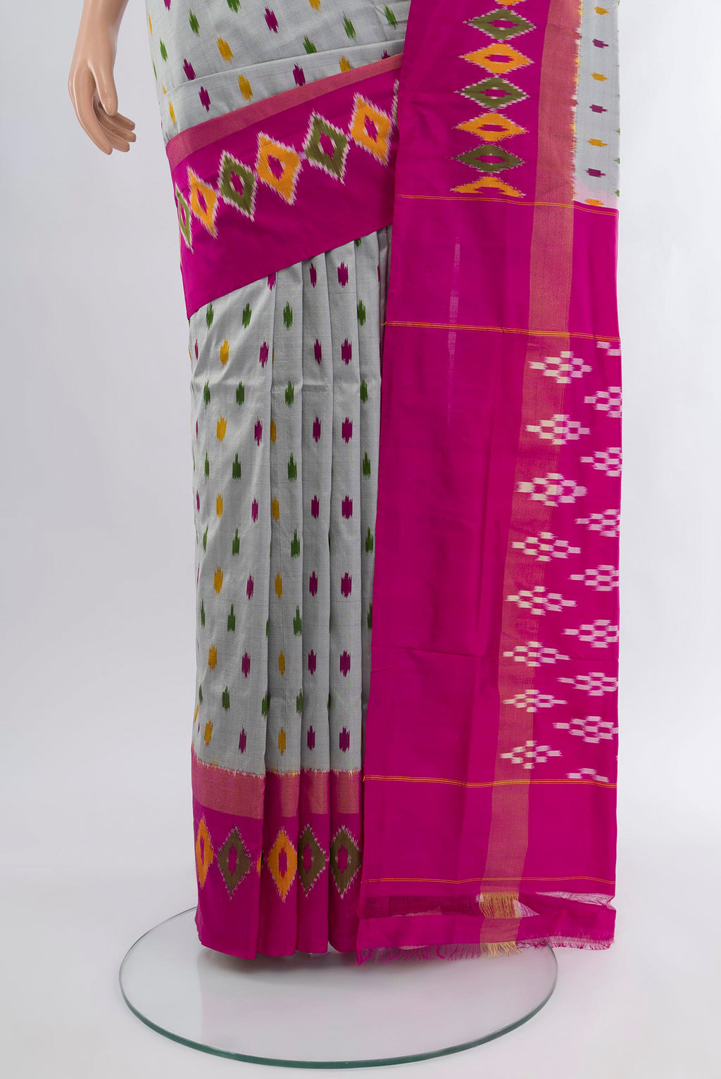 Pleats and pallu of Grey Pochampally Silk Saree with Ikat Print on the body and Ikat Border. 