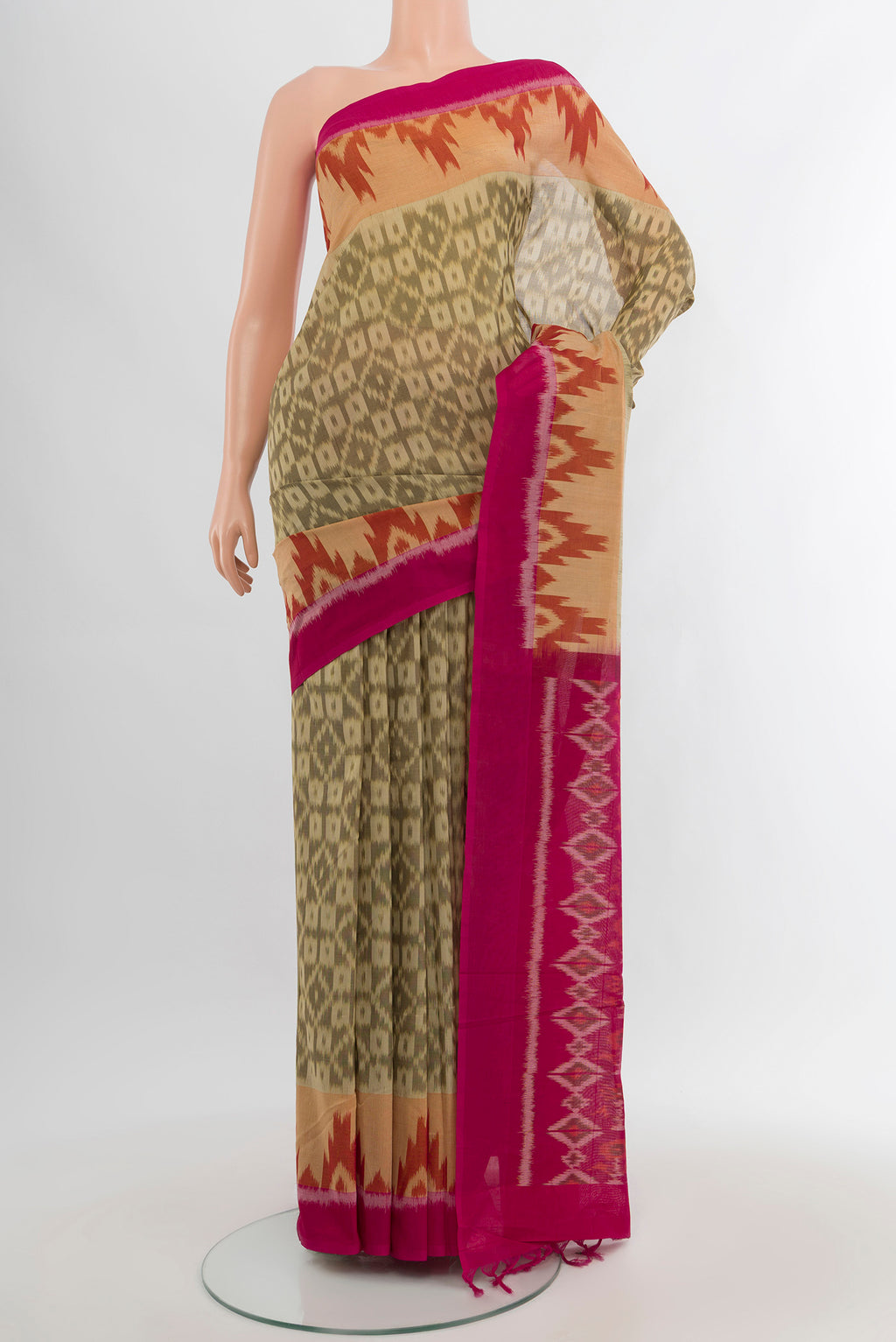 Beige Silk Cotton Saree with Ikat Print on the body and Plain Border.  displayed on a mannequin