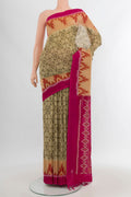 Beige Silk Cotton Saree with Ikat Print on the body and Plain Border.  displayed on a mannequin