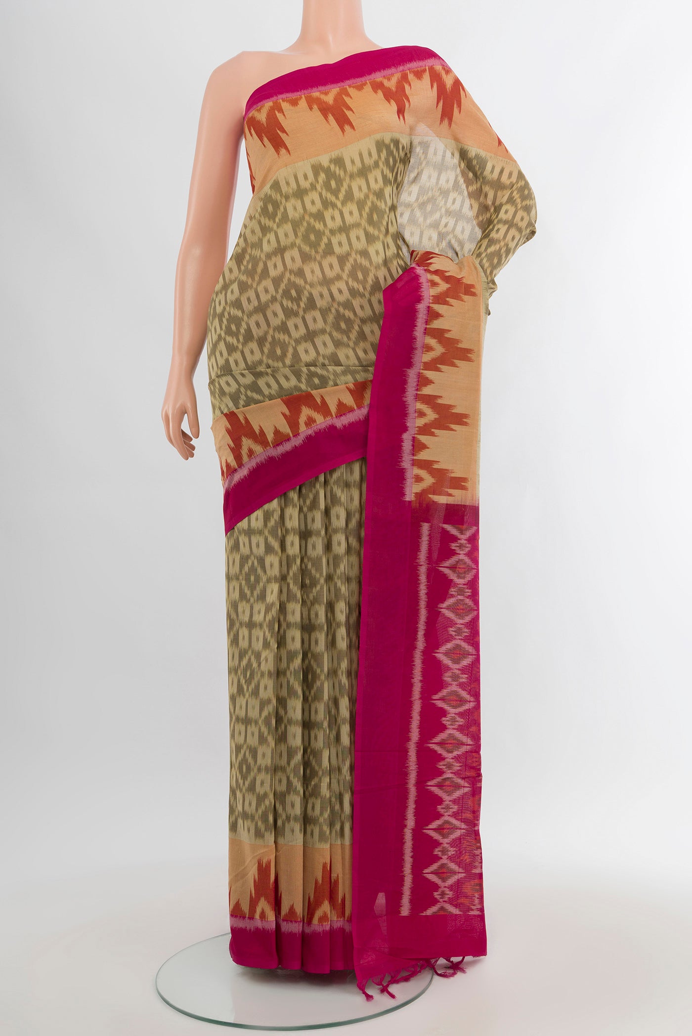 Beige Silk Cotton Saree with Ikat Print on the body and Plain Border.  displayed on a mannequin
