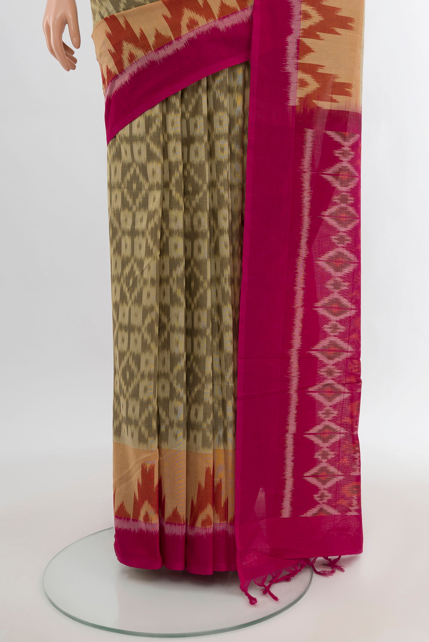 Pleats and pallu of Beige Silk Cotton Saree with Ikat Print on the body and Plain Border. 