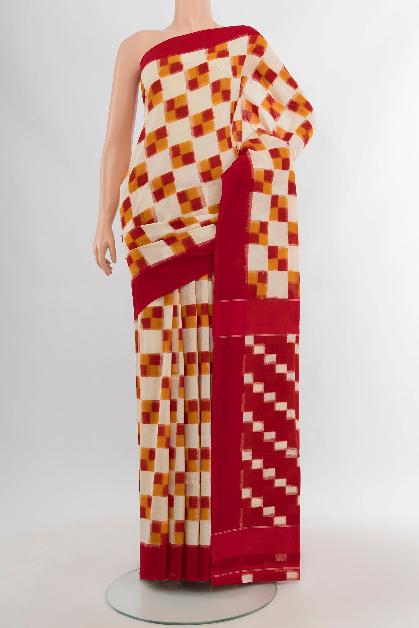 Multi Color Pochampally Cotton Saree with Ikat Print on the body and Plain Border.  displayed on a mannequin