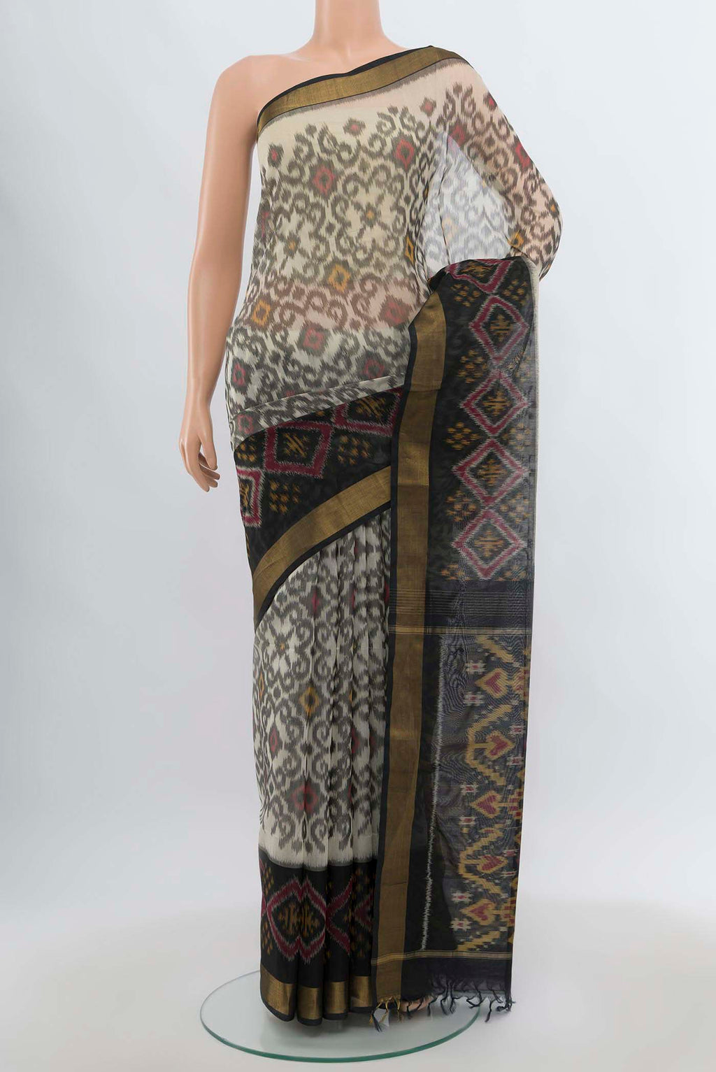 Multi Color Kora Cotton Saree with Zari Butta on the body and Zari Border.  displayed on a mannequin