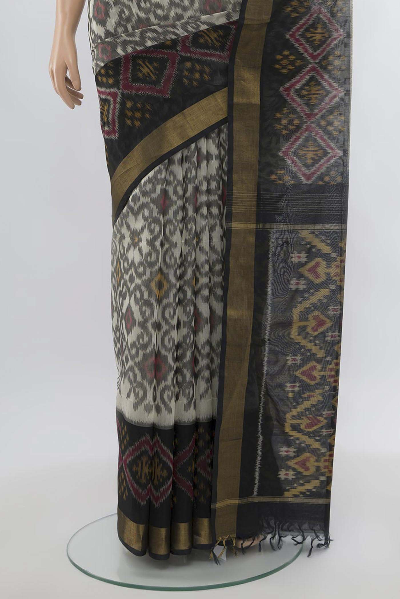 Pleats and pallu of Multi Color Kora Cotton Saree with Zari Butta on the body and Zari Border. 