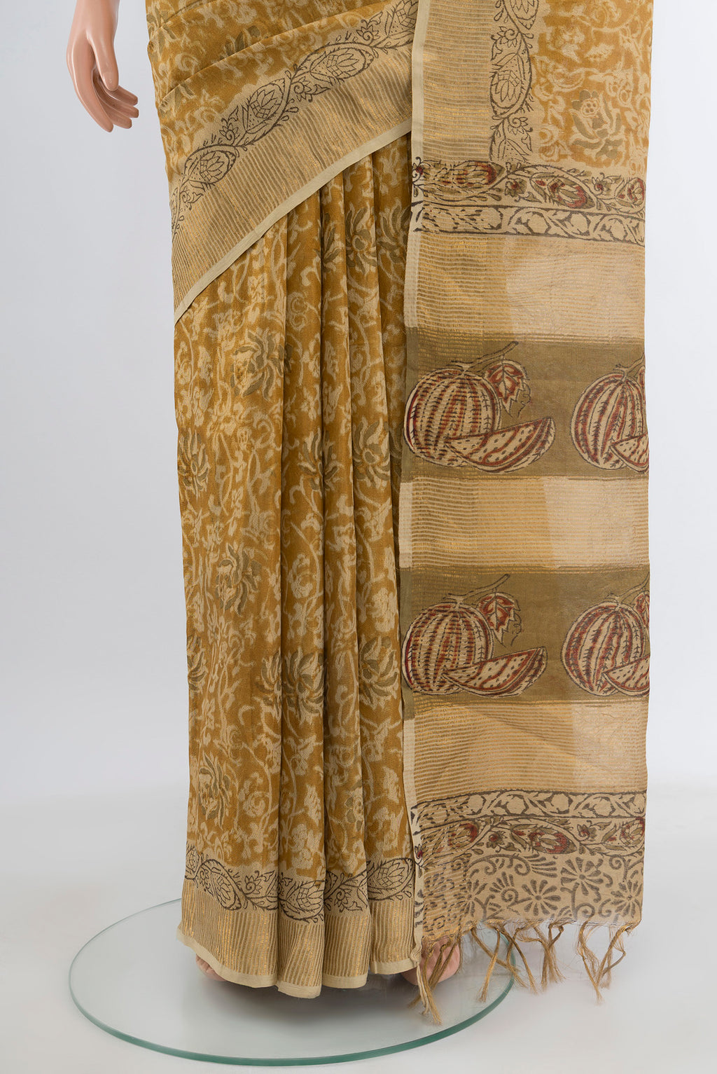 Pleats and pallu of Mustard Tussar Silk Saree with kalamkari Print on the body and Zari Border. 