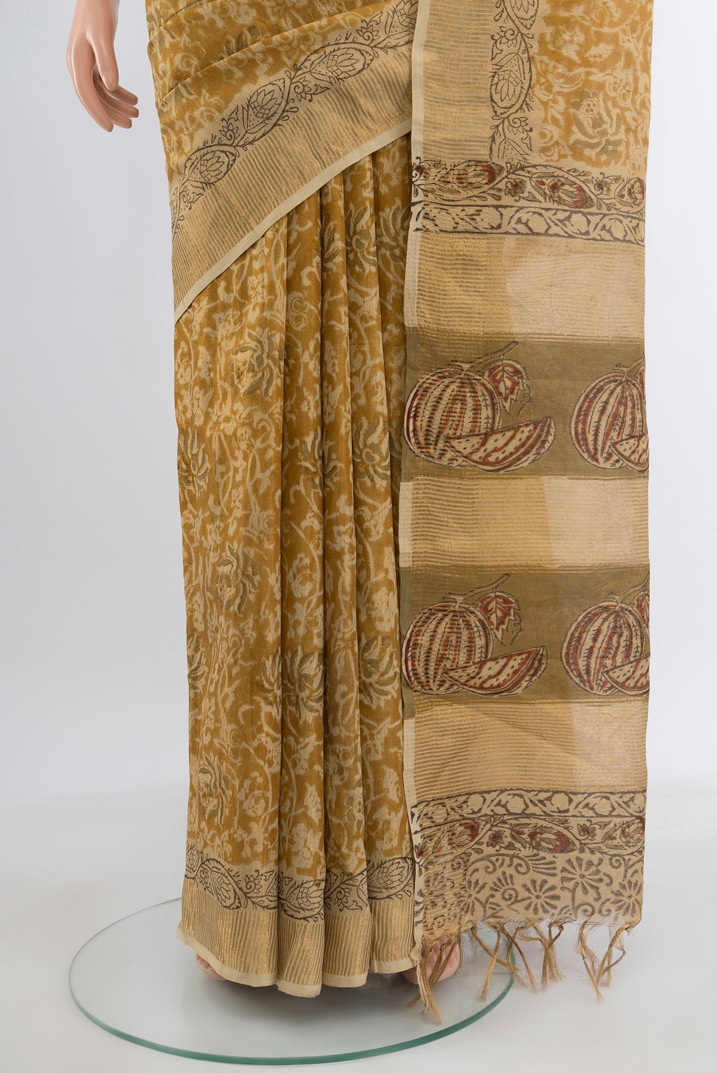 Pleats and pallu of Mustard Tussar Silk Saree with kalamkari Print on the body and Zari Border. 