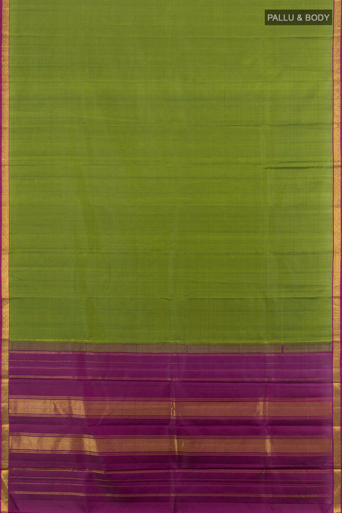 Flat view of Green Kanjivaram Silk Saree with Zari Butta on the body and Silk Border. 