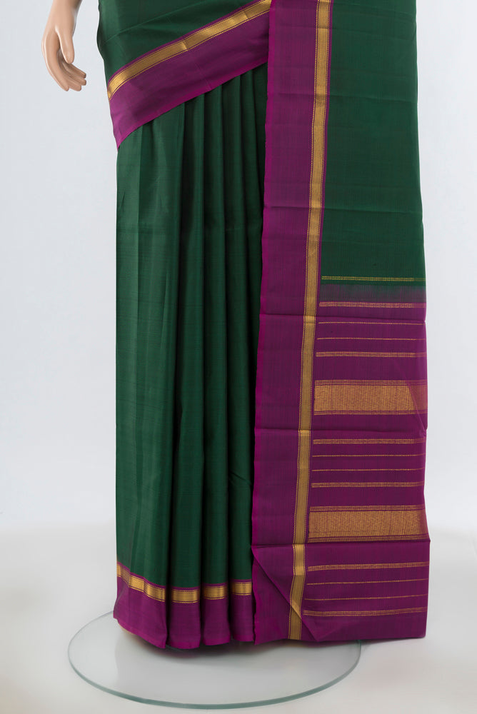 Pleats and pallu of Mint Green Kanjivaram Silk Saree with Plain Body and Silk Border. 