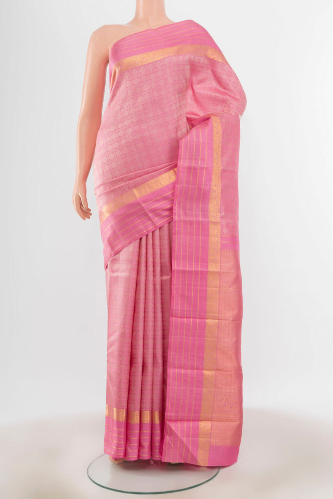 Rose pink Kanchipuram Silk Saree with Zari Butta on the body and Silk Border.  displayed on a mannequin