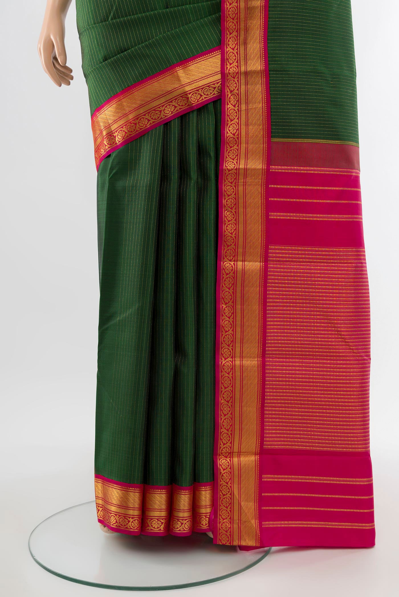 Pleats and pallu of Pure Silk Pure Zari Bottle Green Kanjivaram Saree with Zari Butta on the body and Silk Border. 