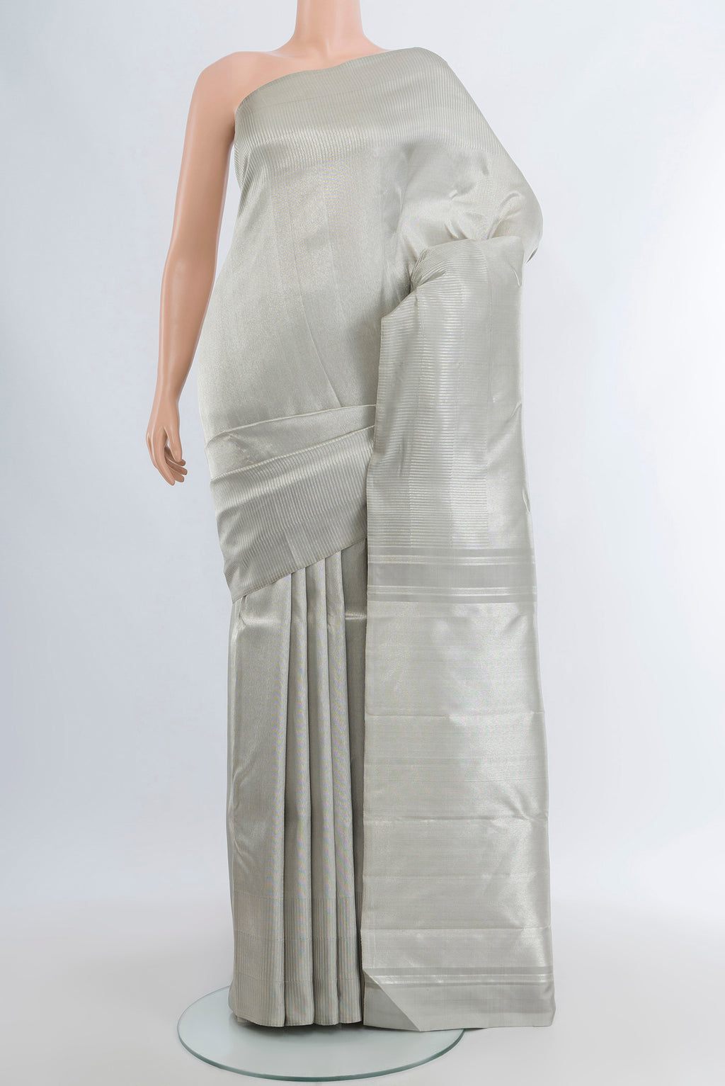 Silver Kanchipuram Silk Saree with Zari Brocade on the body and Zari Border.  displayed on a mannequin