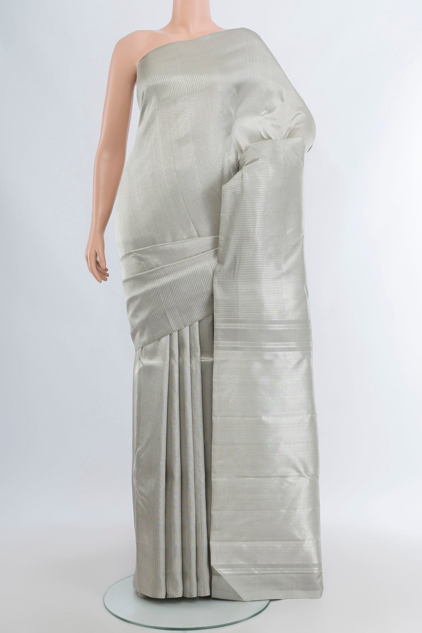 Silver Kanchipuram Silk Saree with Zari Brocade on the body and Zari Border.  displayed on a mannequin