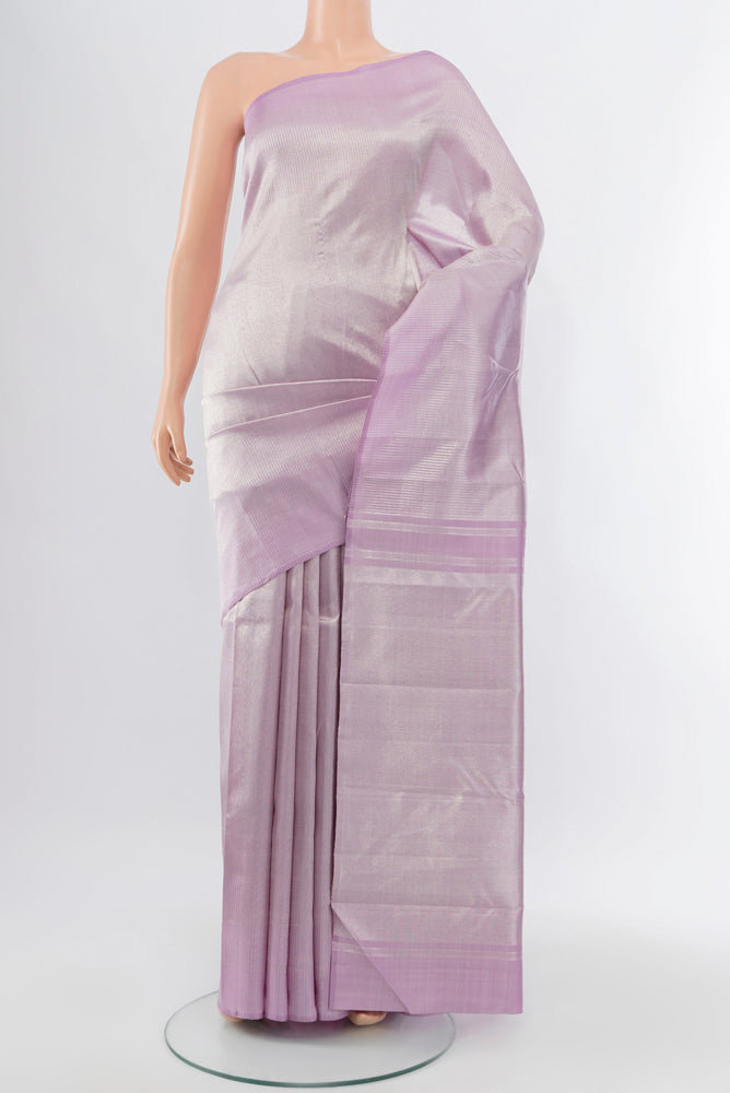 Lavender Kanchipuram Silk Saree with Zari Butta on the body and Silk Border.  displayed on a mannequin
