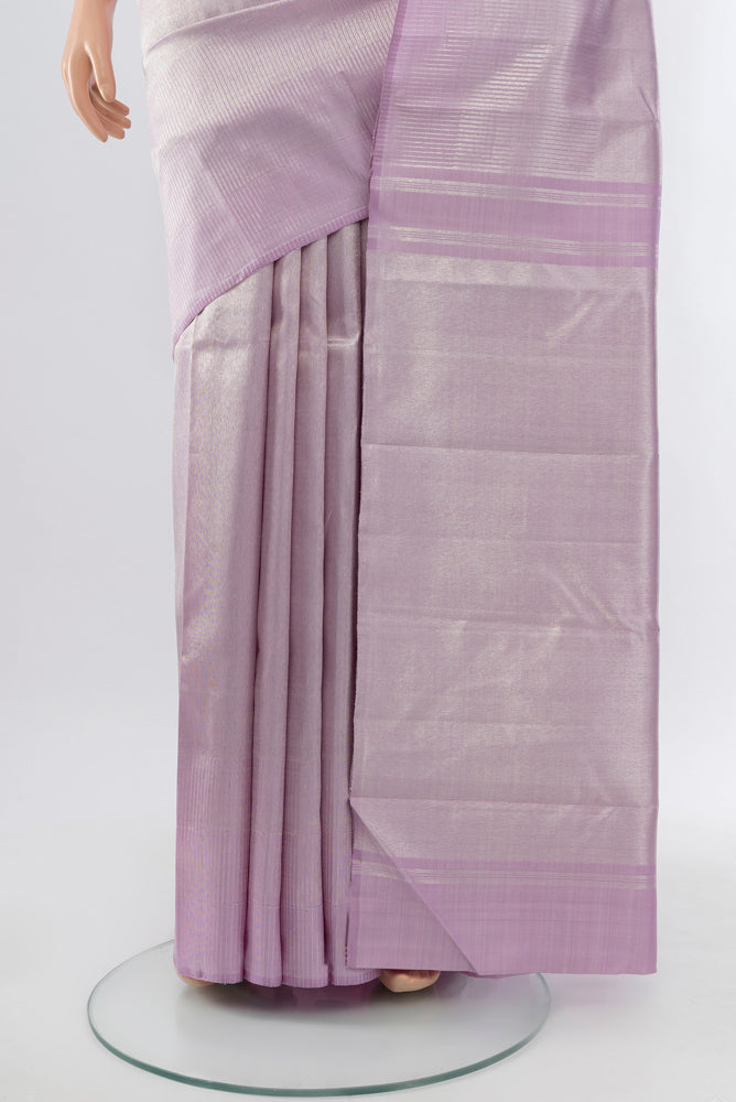 Pleats and pallu of Lavender Kanchipuram Silk Saree with Zari Butta on the body and Silk Border. 