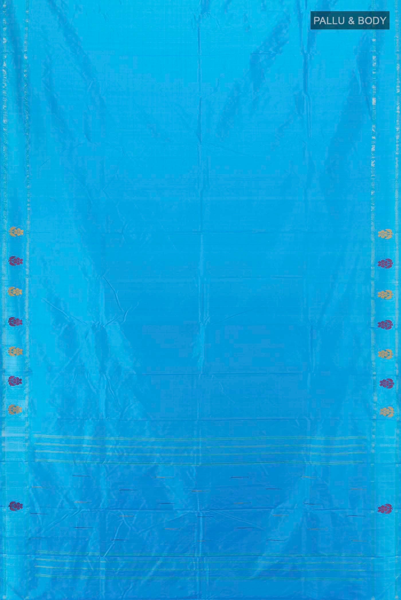 Flat view of Light Blue Kanchipuram Silk Saree with Zari Butta on the body and Silk Border