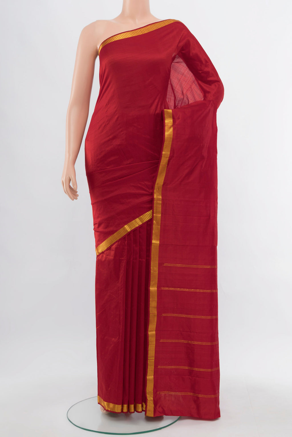 Red Kanchipuram Silk Saree with Zari Butta on the body and Silk Border.  displayed on a mannequin