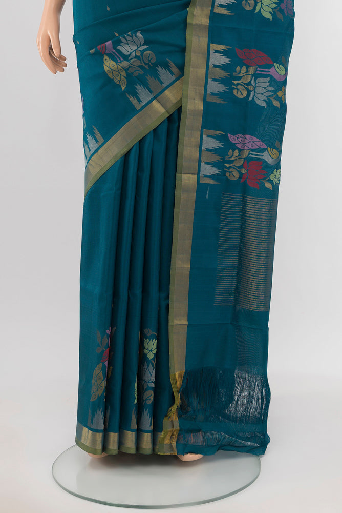 Pleats and pallu of Peacock Blue Uppada Silk Saree with Zari Butta on the body and Silk Border. 