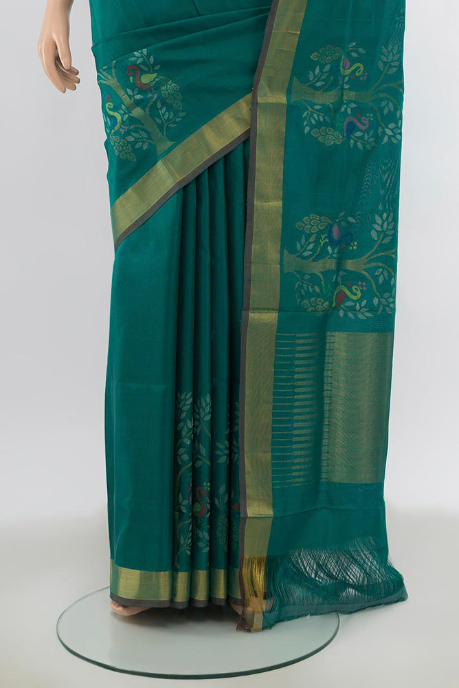Pleats and pallu of Peacock Blue Uppada Silk Saree with Zari Butta on the body and Silk Border. 