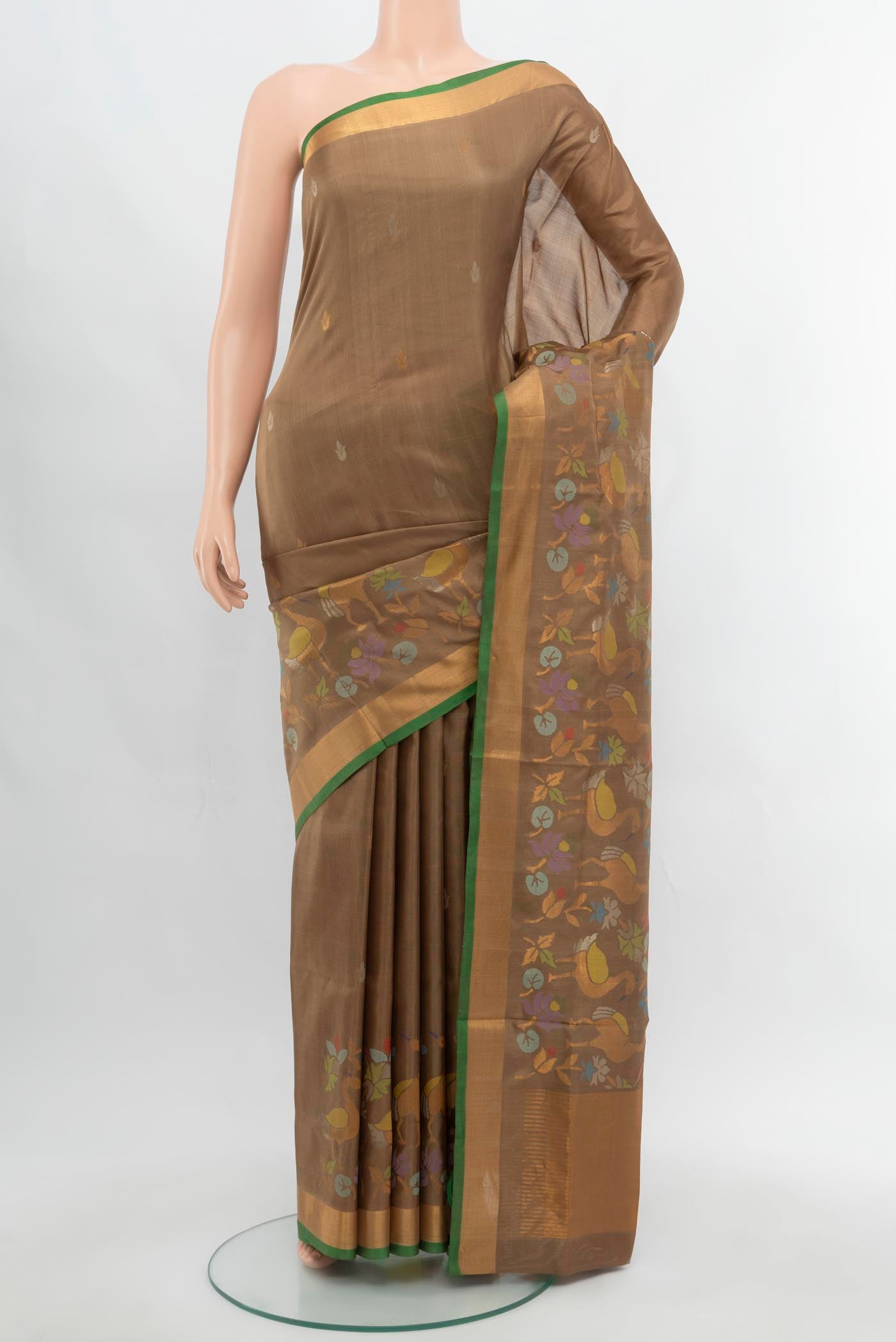 Brown Uppada Silk Saree with Zari Butta on the body and Silk Border.  displayed on a mannequin