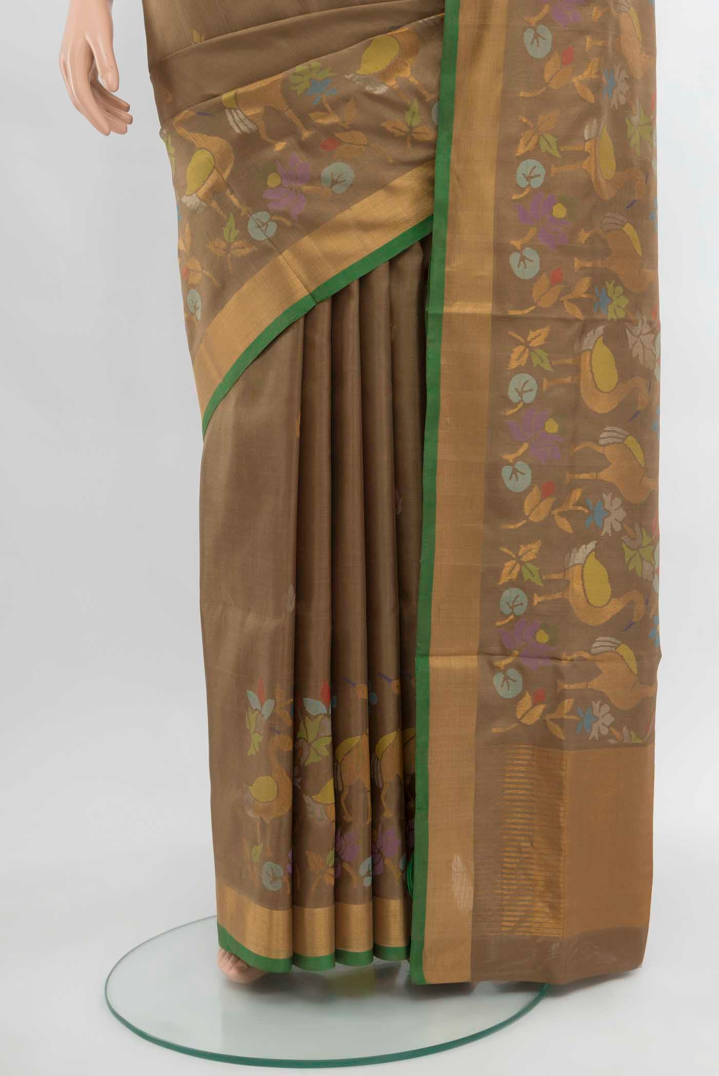 Pleats and pallu of Brown Uppada Silk Saree with Zari Butta on the body and Silk Border. 