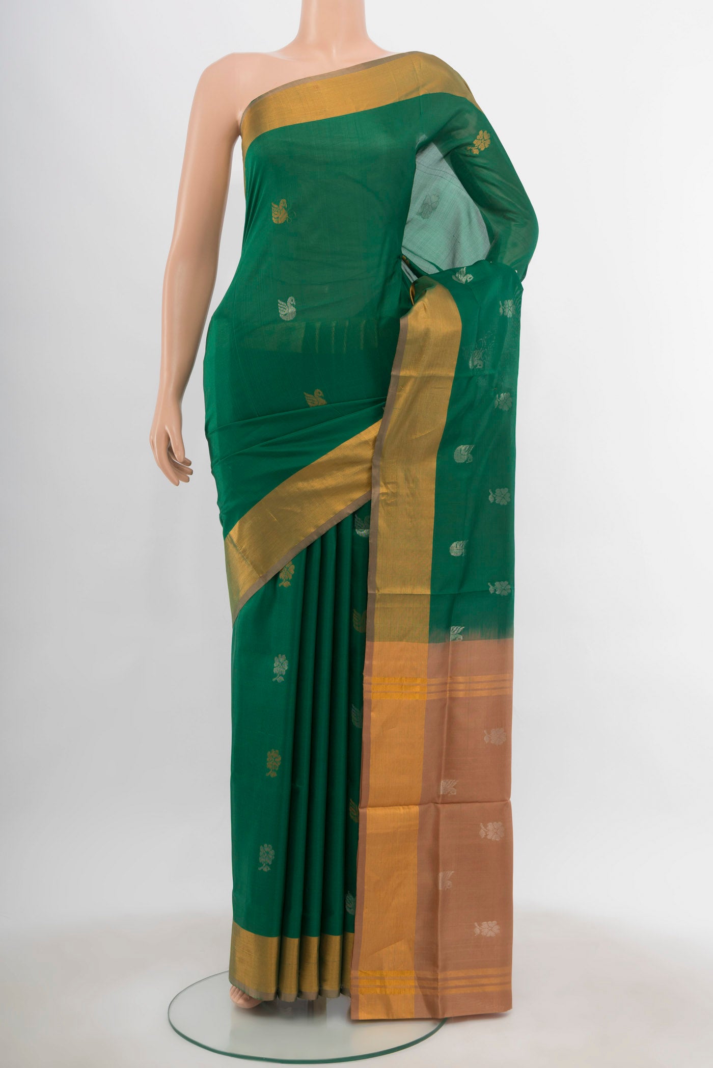 Mint Green Uppada Silk Saree with Zari Butta on the body and Silk Border.  displayed on a mannequin