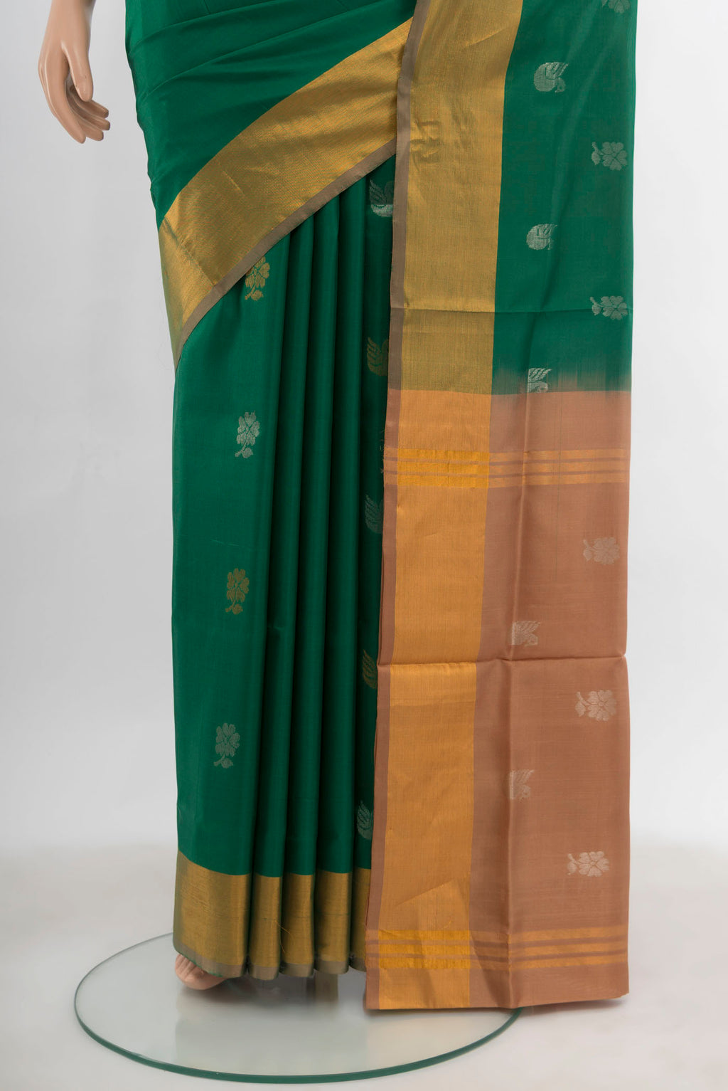 Pleats and pallu of Mint Green Uppada Silk Saree with Zari Butta on the body and Silk Border. 