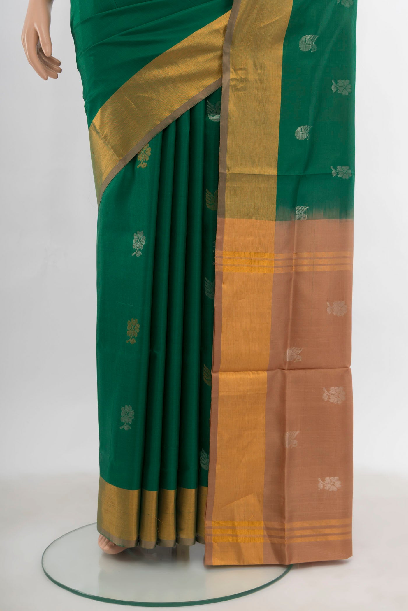 Pleats and pallu of Mint Green Uppada Silk Saree with Zari Butta on the body and Silk Border. 