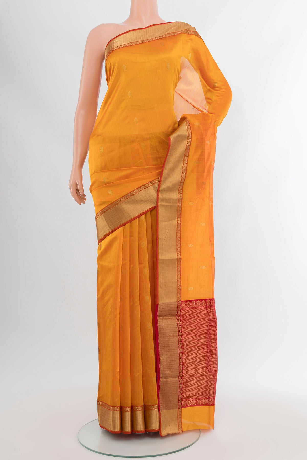 Yellow Chanderi Silk Cotton Saree with Zari Butta on the body and Zari Border.  displayed on a mannequin