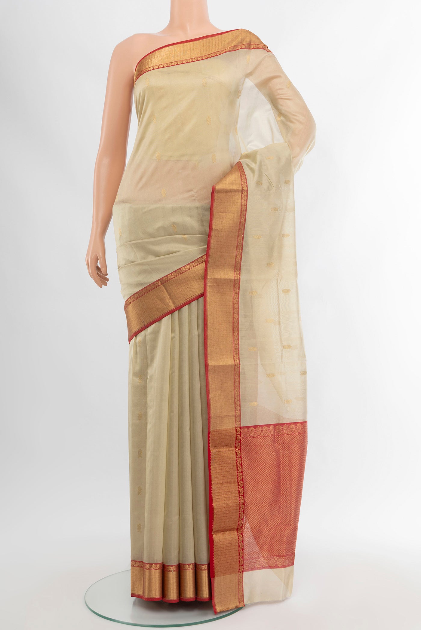 Cream Chanderi Silk Cotton Saree with Zari Butta on the body and Zari Border.  displayed on a mannequin