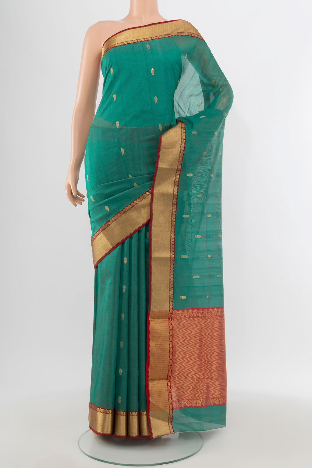Teal Chanderi Silk Cotton Saree with Zari Butta on the body and Zari Border.  displayed on a mannequin