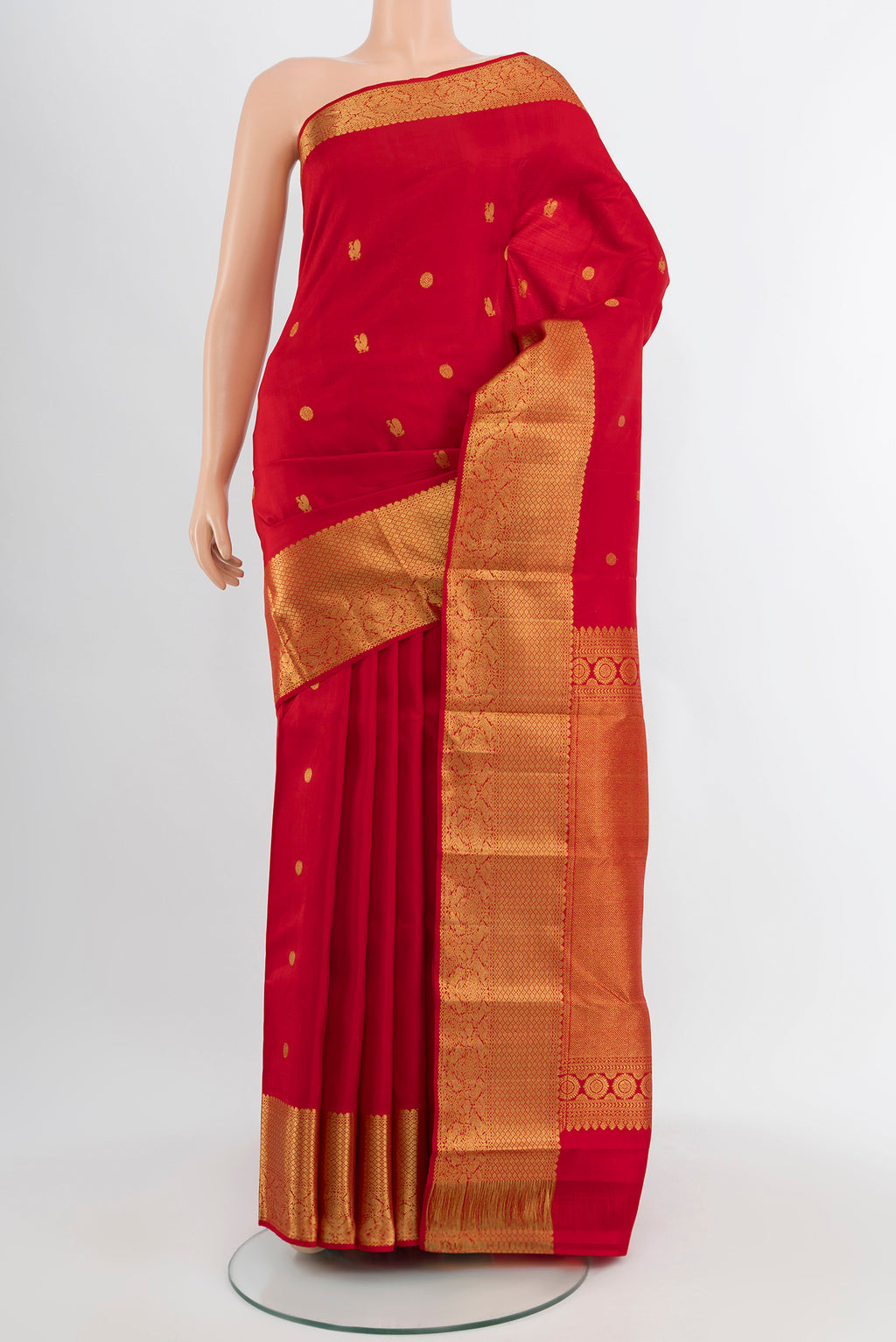 Red Kanchipuram Silk Saree with Zari Butta on the body and Silk Border.  displayed on a mannequin