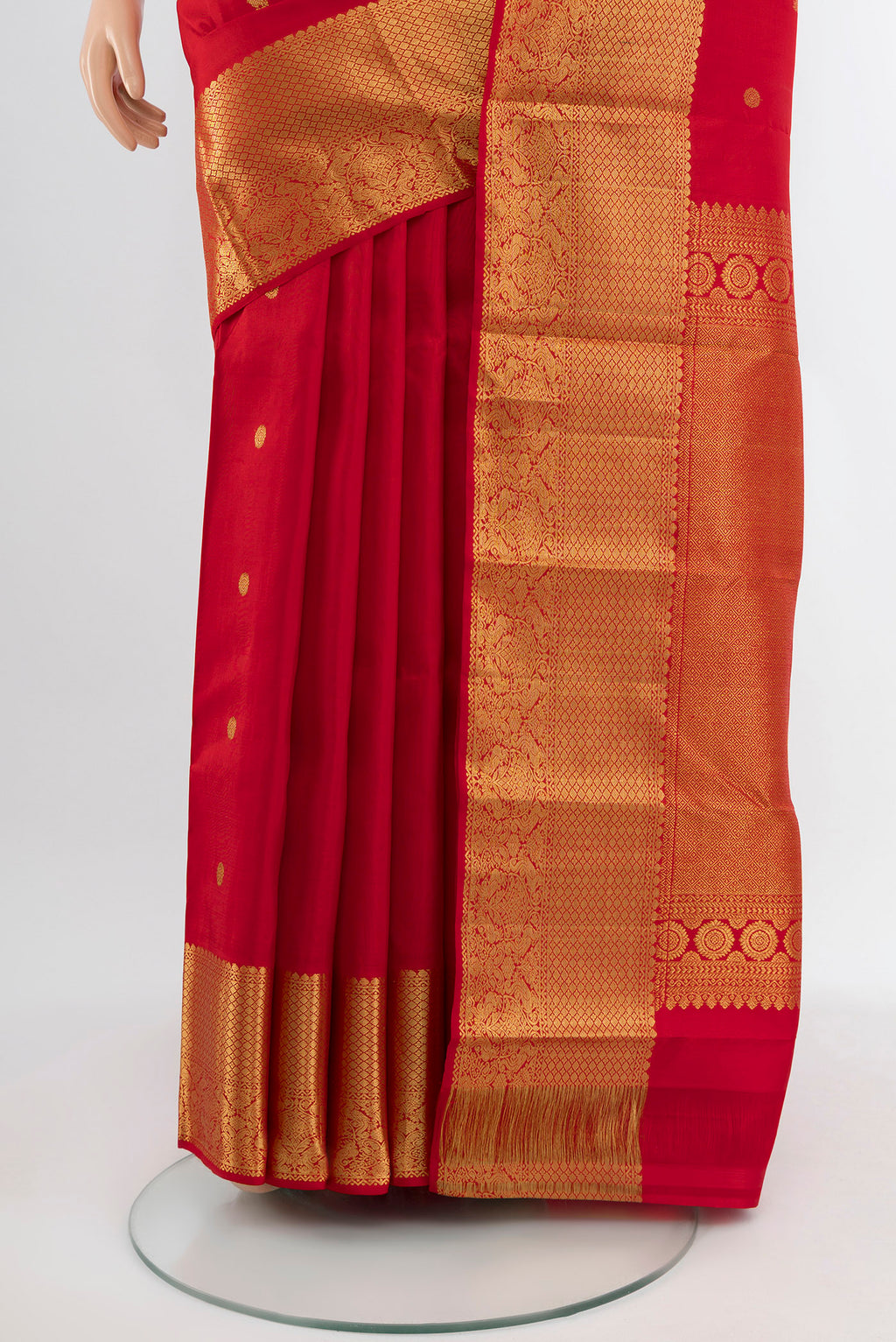 Pleats and pallu of Red Kanchipuram Silk Saree with Zari Butta on the body and Silk Border. 