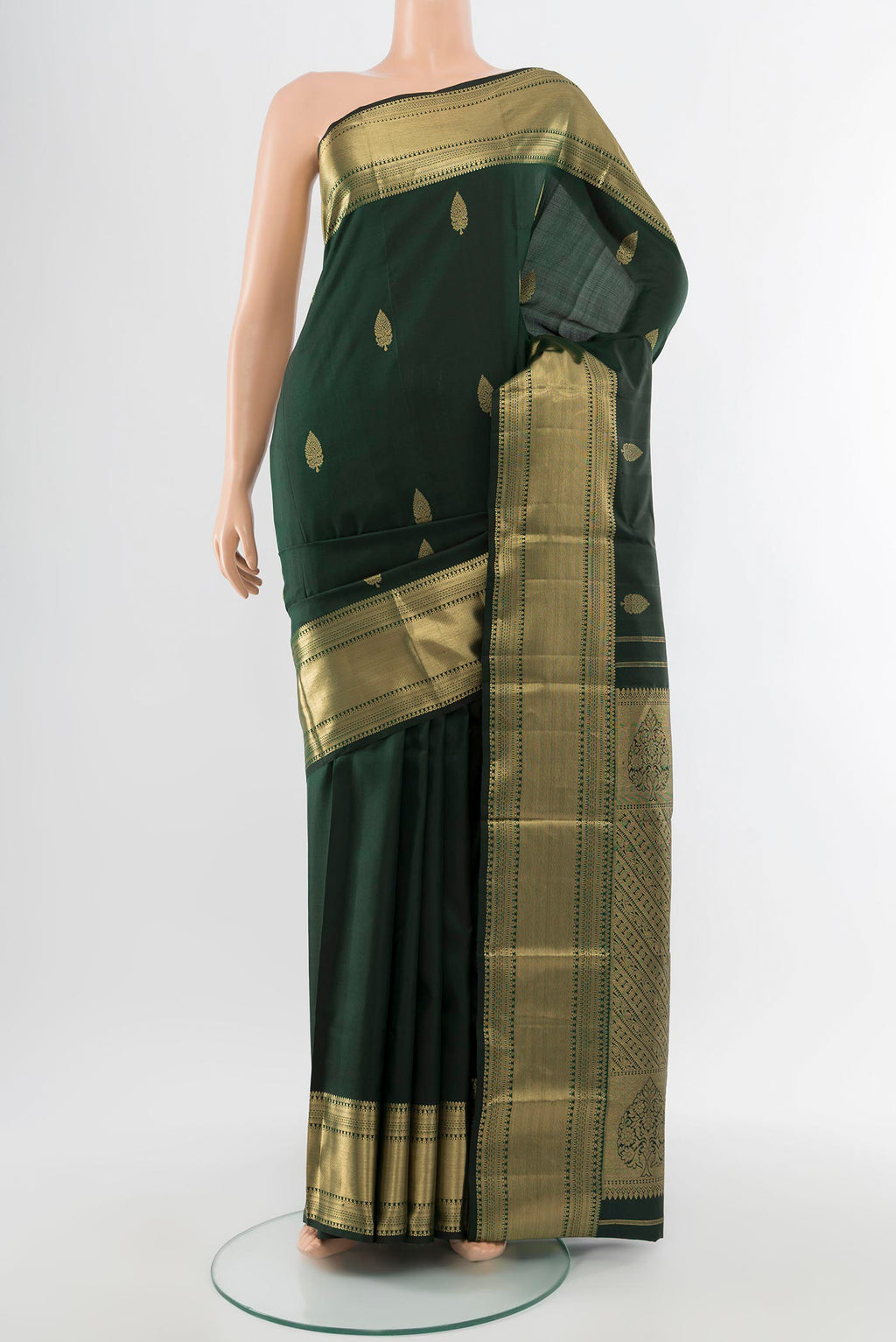 Pure Silk Pure Zari Black Kanchipuram Saree with Zari Butta on the body and Silk Border.  displayed on a mannequin