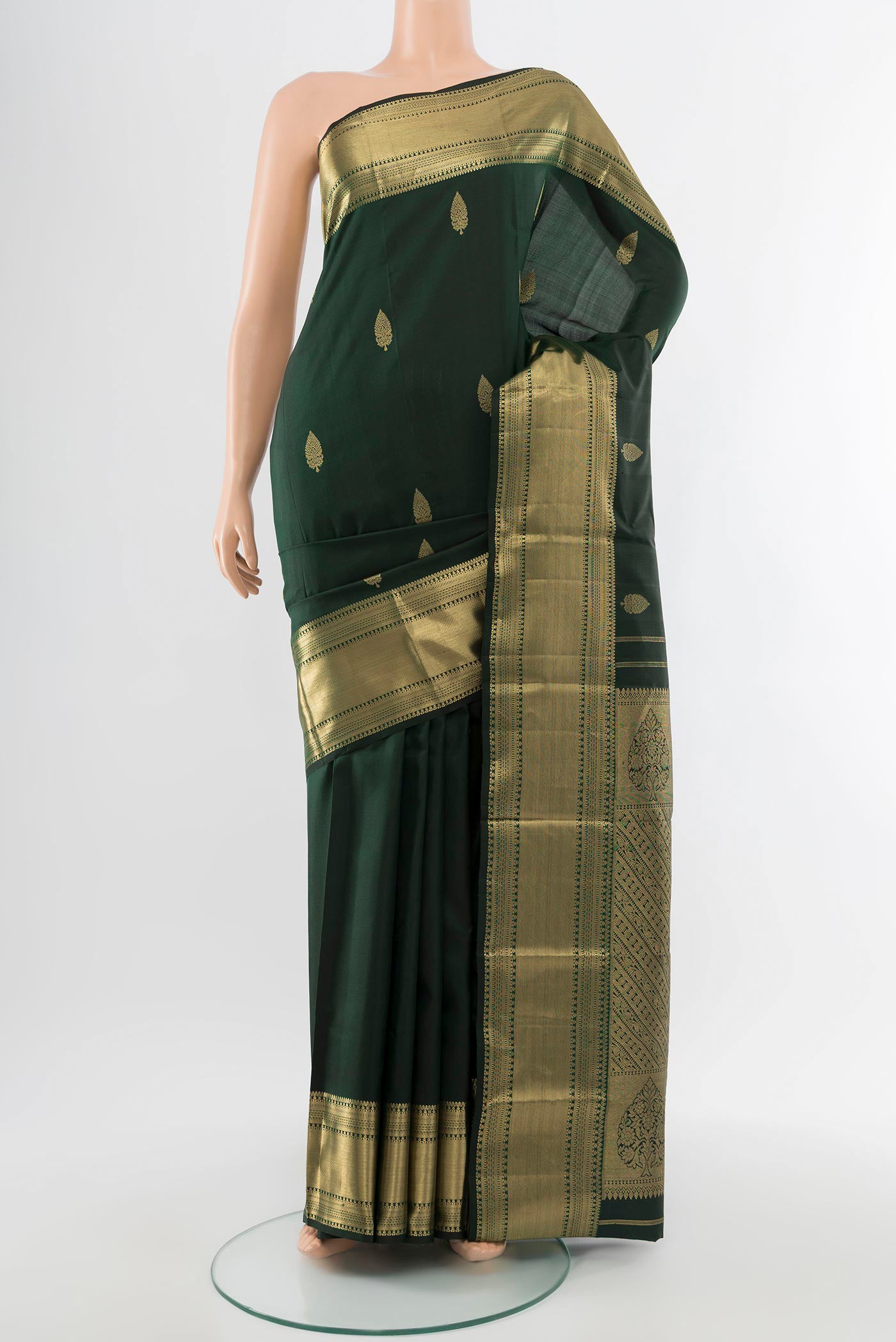 Pure Silk Pure Zari Black Kanchipuram Saree with Zari Butta on the body and Silk Border.  displayed on a mannequin