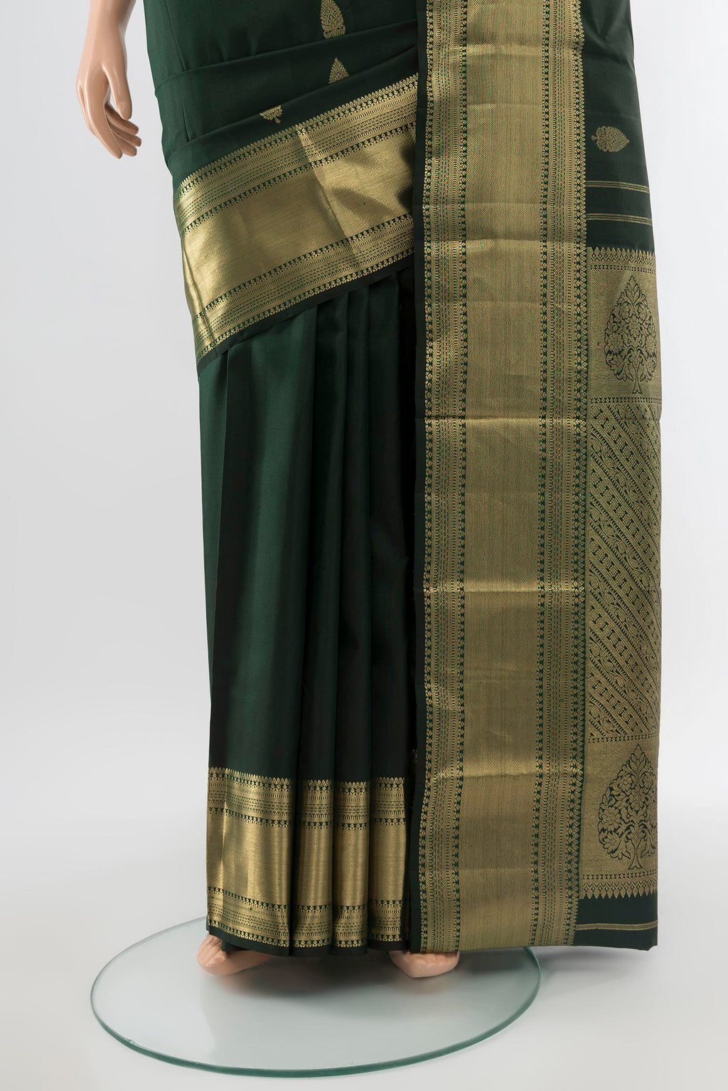 Pleats and pallu of Pure Silk Pure Zari Black Kanchipuram Saree with Zari Butta on the body and Silk Border. 