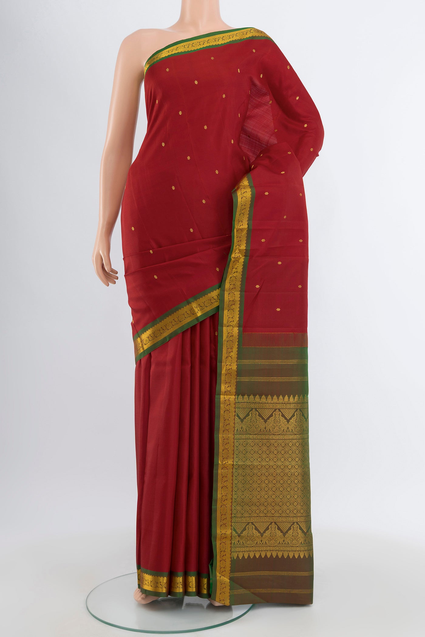Red Kanchipuram Silk Saree with Zari Butta on the body and Zari Border.  displayed on a mannequin