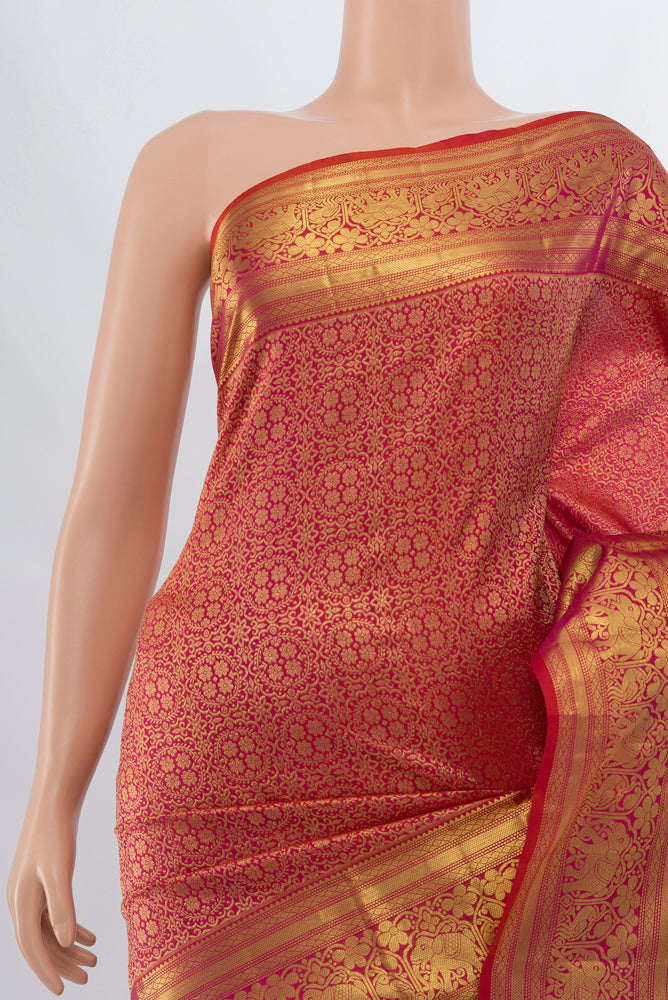Border image of Peach Kanjivaram Silk Saree with Zari Brocade on the body and Silk Border. 