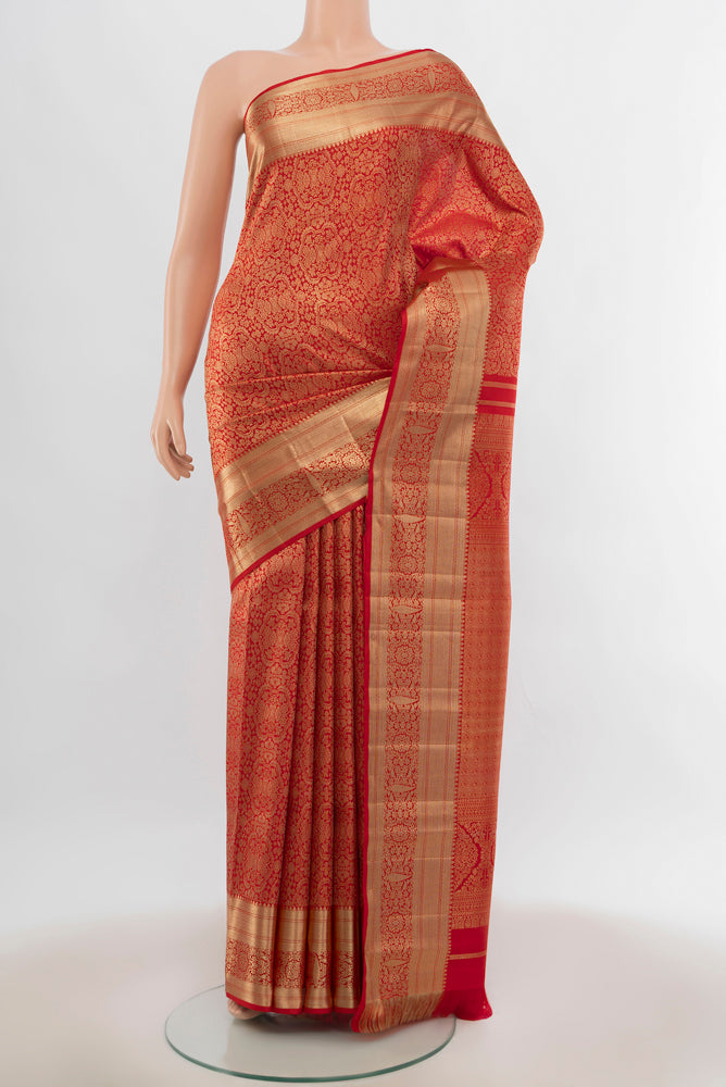 Red Kanjivaram Silk Saree with Zari Butta on the body and Silk Border.  displayed on a mannequin